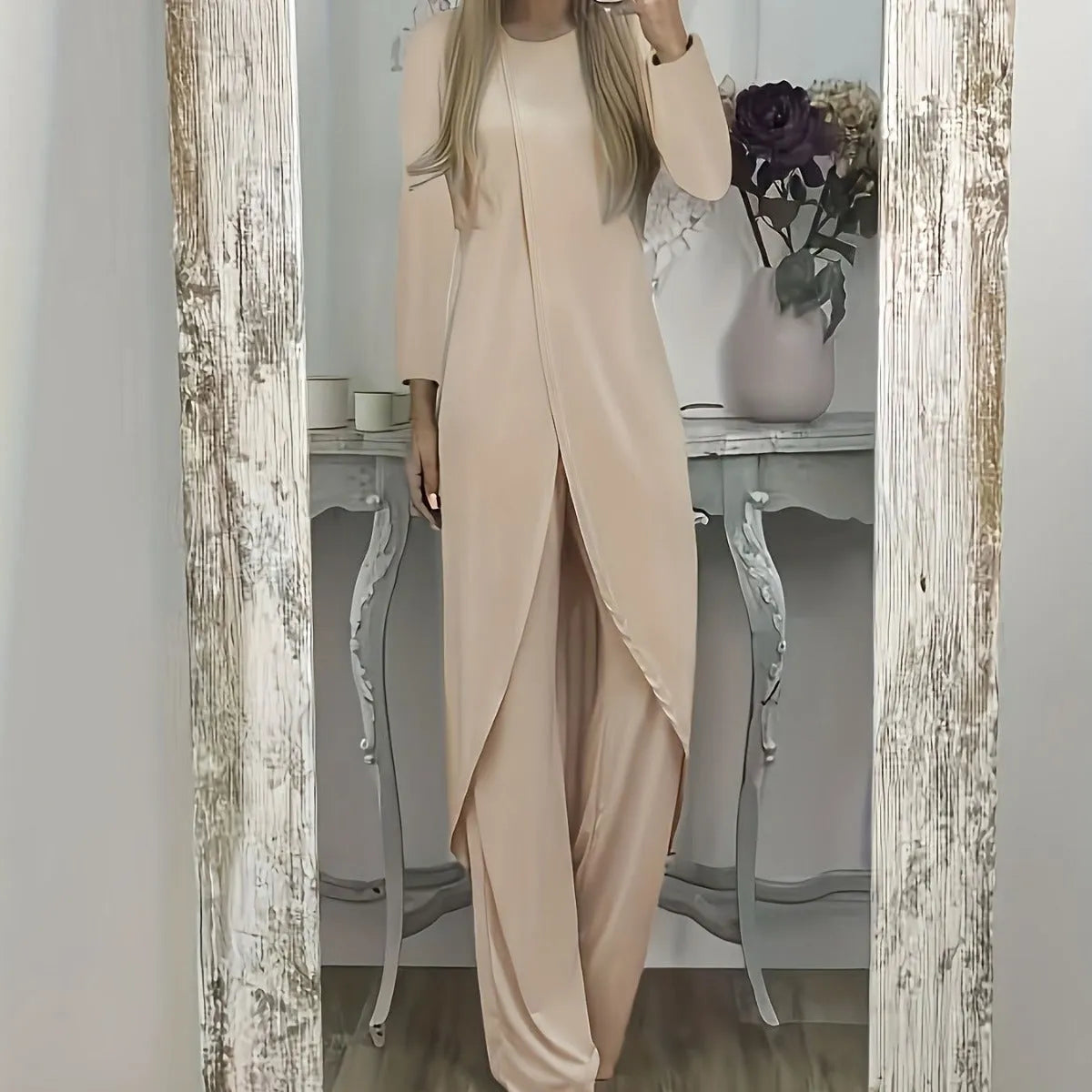 Black loose fit casual two-piece lounge set with long sleeve top and trousers on a hanger.