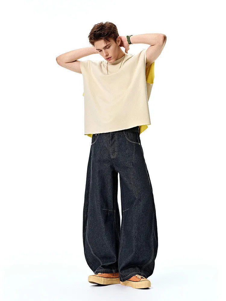 Men's wide leg denim trousers in original cow colour showing mid waist and straight leg design