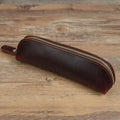 Square leather pencil case with zip closure in black colour showing 18cm dimensions