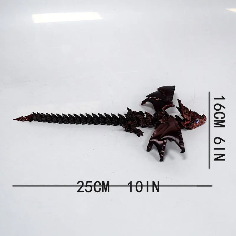 3D printed red and gold flying dragon wings decoration toy on a white background.