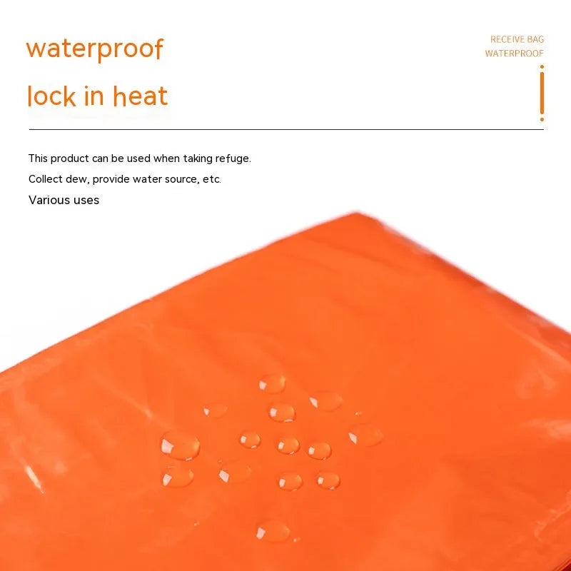 Orange emergency tent with sleeping bag and raincoat for disaster relief camping