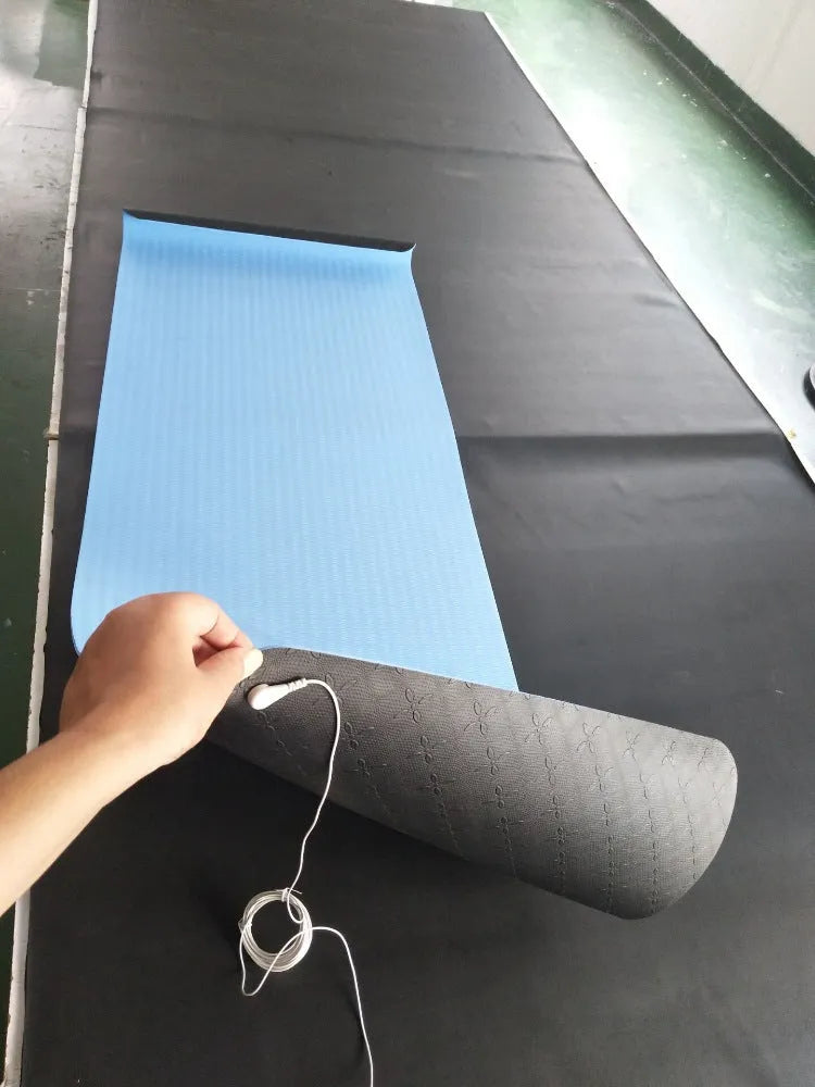 Blue conductive yoga mat with botanical pattern and integrated grounding wire