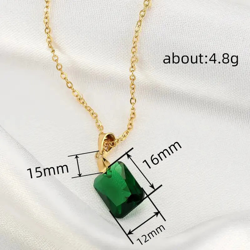 Copper rectangular geometric pendant necklace on an O-ring chain in a retro green colour.