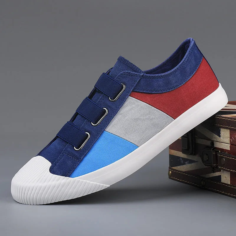 Men's low-top canvas sneakers in beige with colour stitching and an elastic band closure.