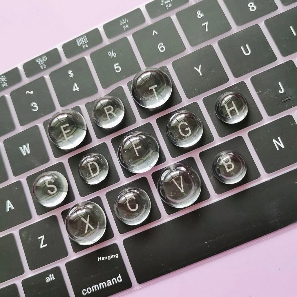 Crystal glass ball keyboard stickers in 12x6mm size on a white keyboard showing raised design