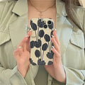 Black silicone iPhone case with tulip pattern design for multiple iPhone models