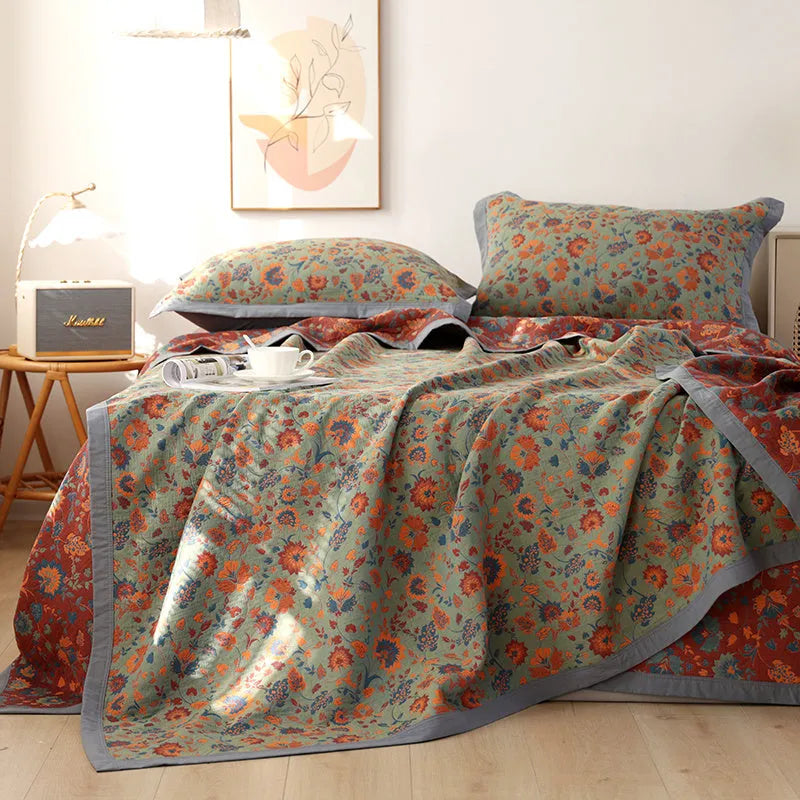 Cotton gauze bed blanket three-piece set with floral plant pattern showing blanket and two pillowcases
