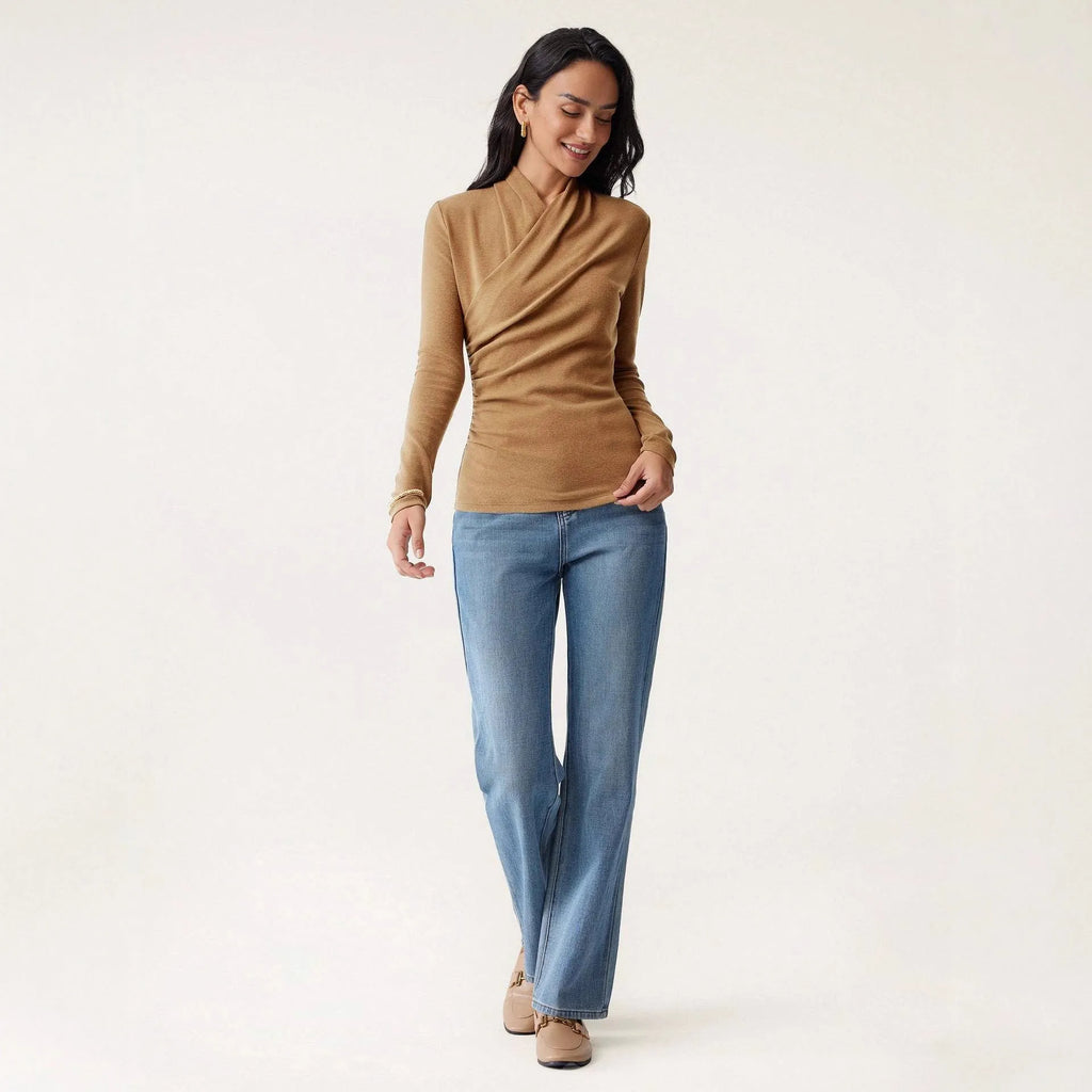 Camel-coloured women's slim fit pullover sweater with long sleeves on a hanger.