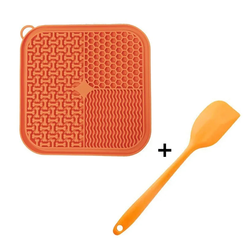 Orange and grey silicone dog licking mat with textured surface and suction cups on back