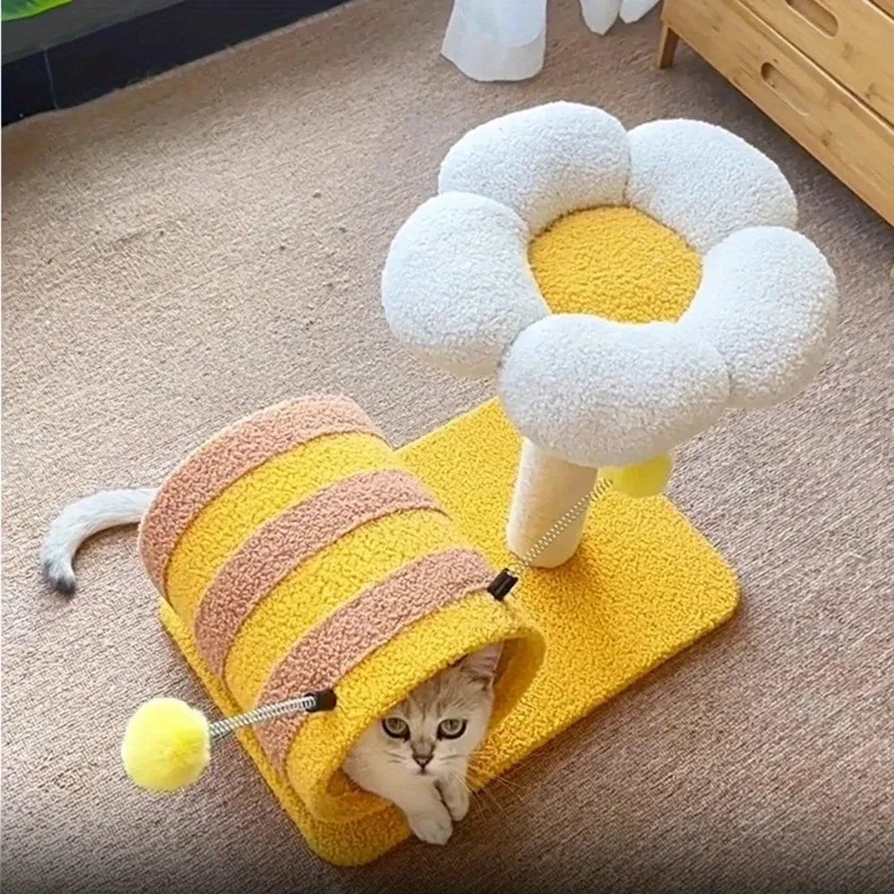 Yellow multi-level cat climbing frame with sisal scratching posts and a central tunnel.