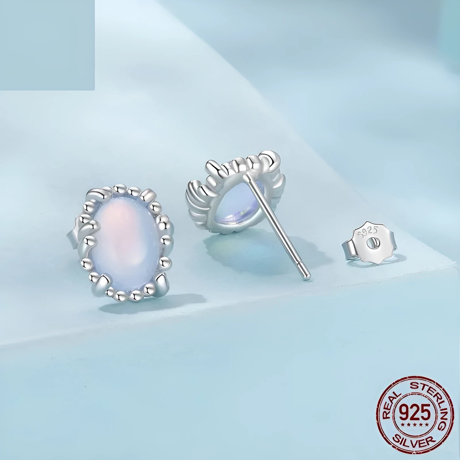 Sterling silver 925 magic stone ellipse stud earrings with French romantic style and electroplated finish