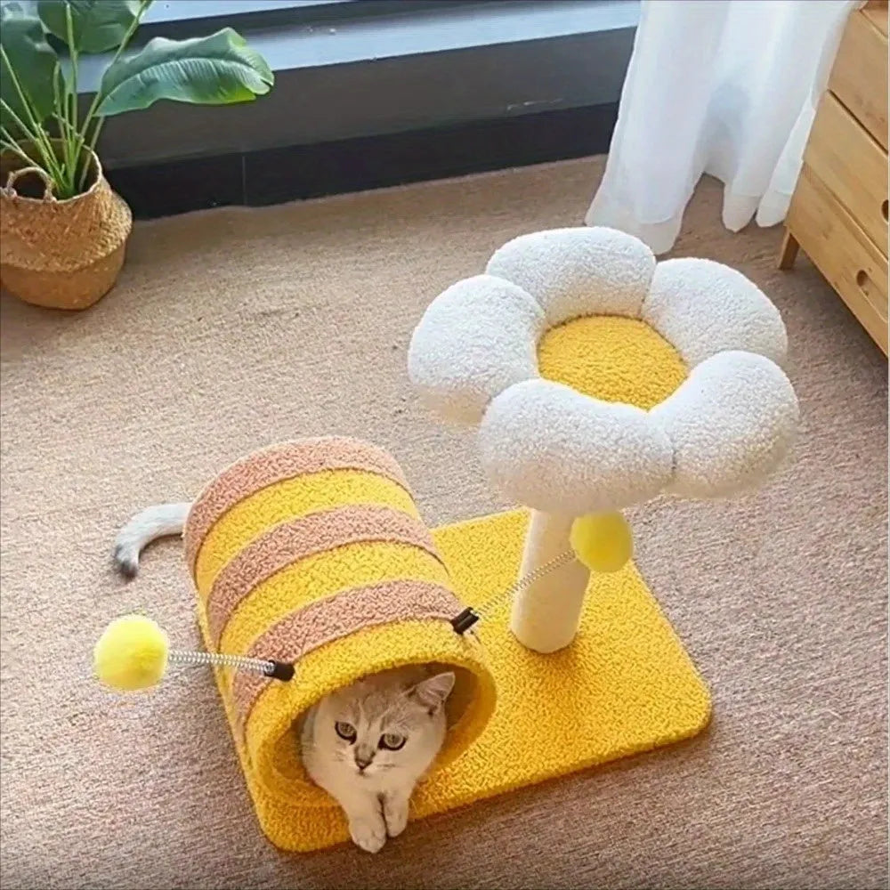 Yellow multi-level cat climbing frame with sisal scratching posts and a central tunnel.