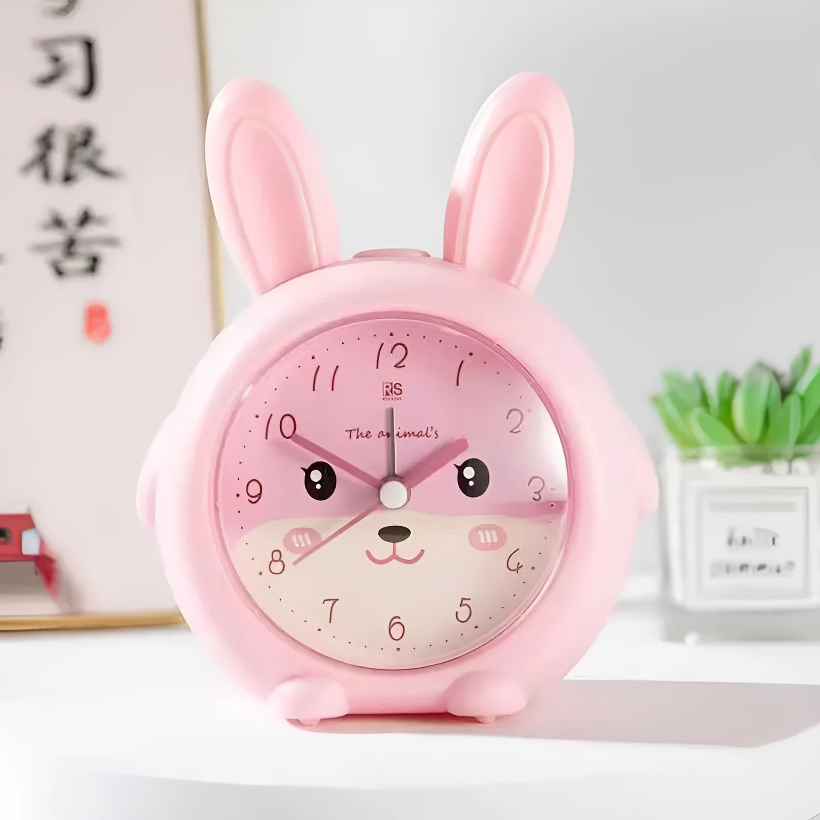Creative fashion cartoon children's singing alarm clock in pink or blue with night light.
