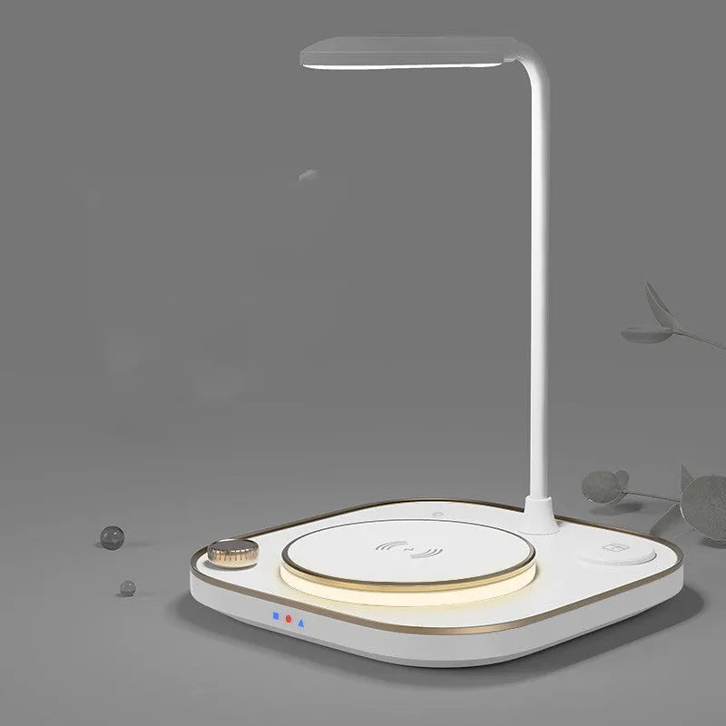 Black 15W wireless magnetic charging dock with integrated USB Type-C cable on a desk.