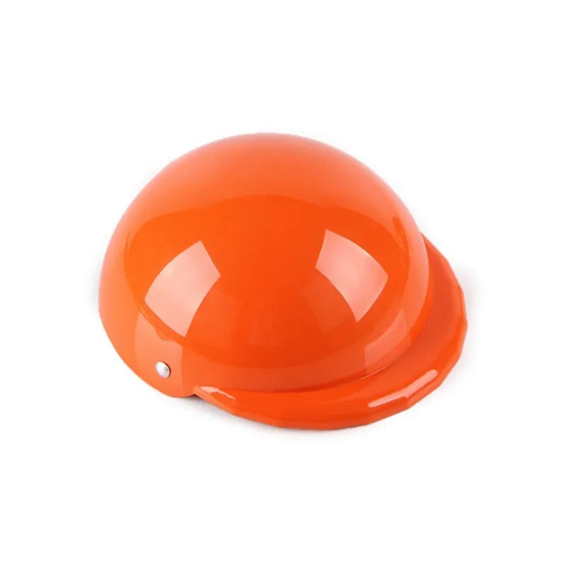 Plastic dog motorcycle cap helmet in various colours and sizes on a table