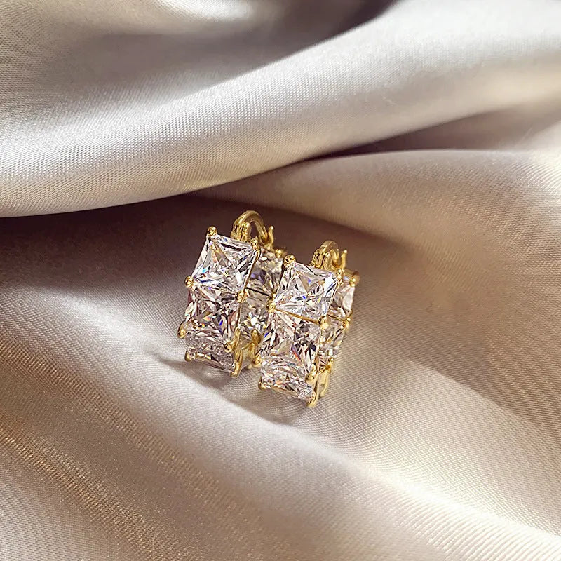 Geometric U-shaped zircon ear rings in gold setting with black, pink or white stone options