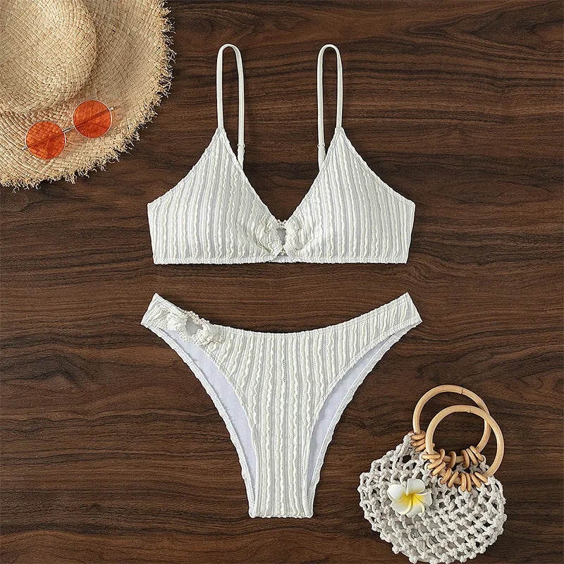 White women's V-neck beach swimsuit with sleeveless design and split cut