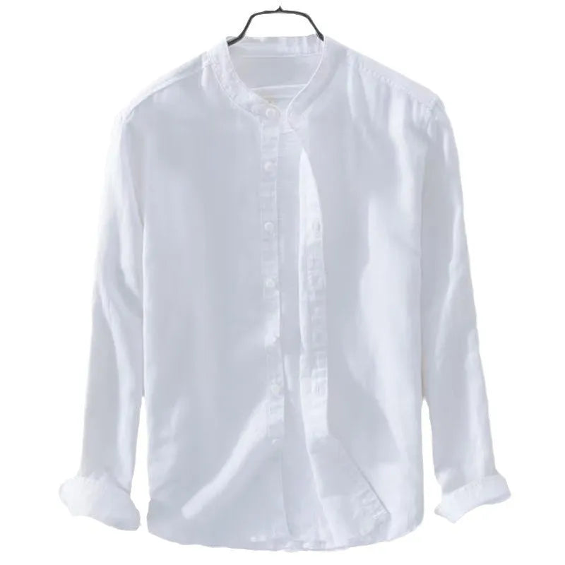 A man wearing a loose-fitting long sleeve linen casual shirt in a solid colour.