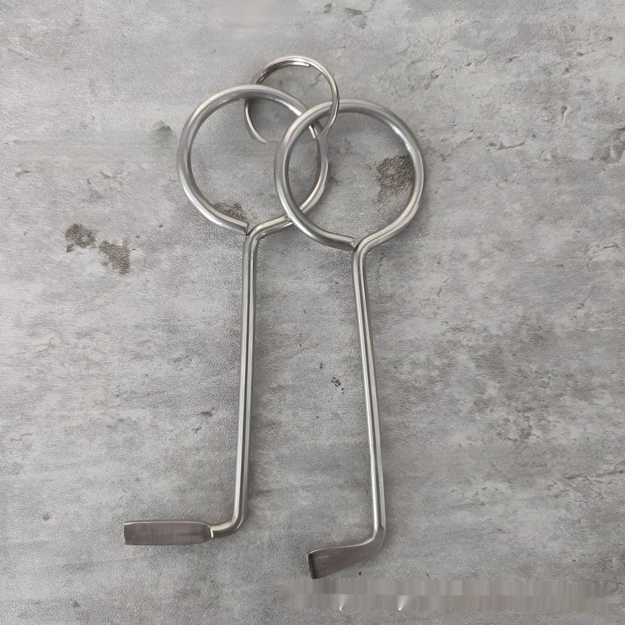 Two alloy wrench tools side by side showing portable universal design for household repairs