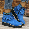 Women's dark brown suede wedge ankle boots with a side zip and decorative tassel.