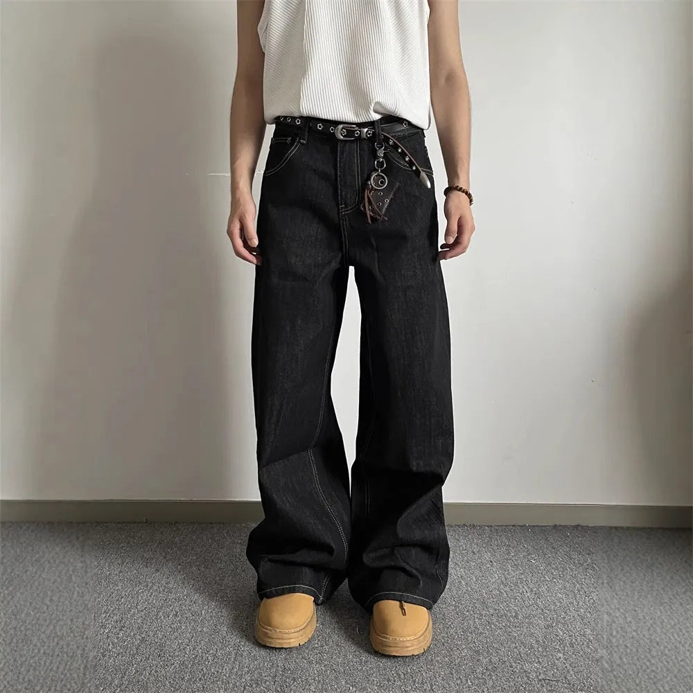 Black retro loose-fit straight-leg jeans with mid-waist and zip fly on hanger