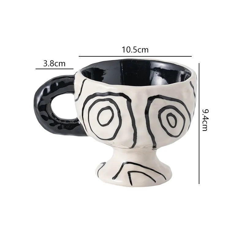 Hand-pinched irregular shaped ceramic mug in a solid colour, modern simple design