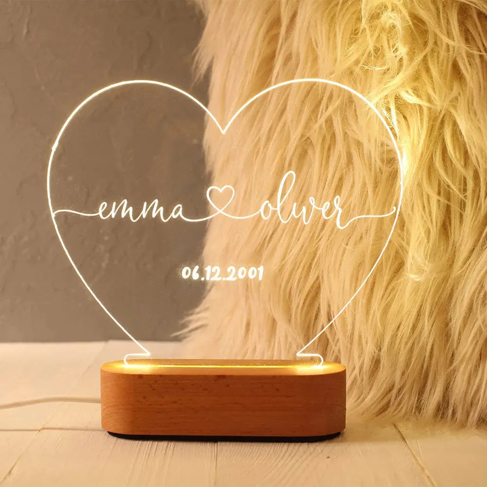Custom acrylic LED night light displaying personal names and date, 20cm by 11.5cm, with USB cable.