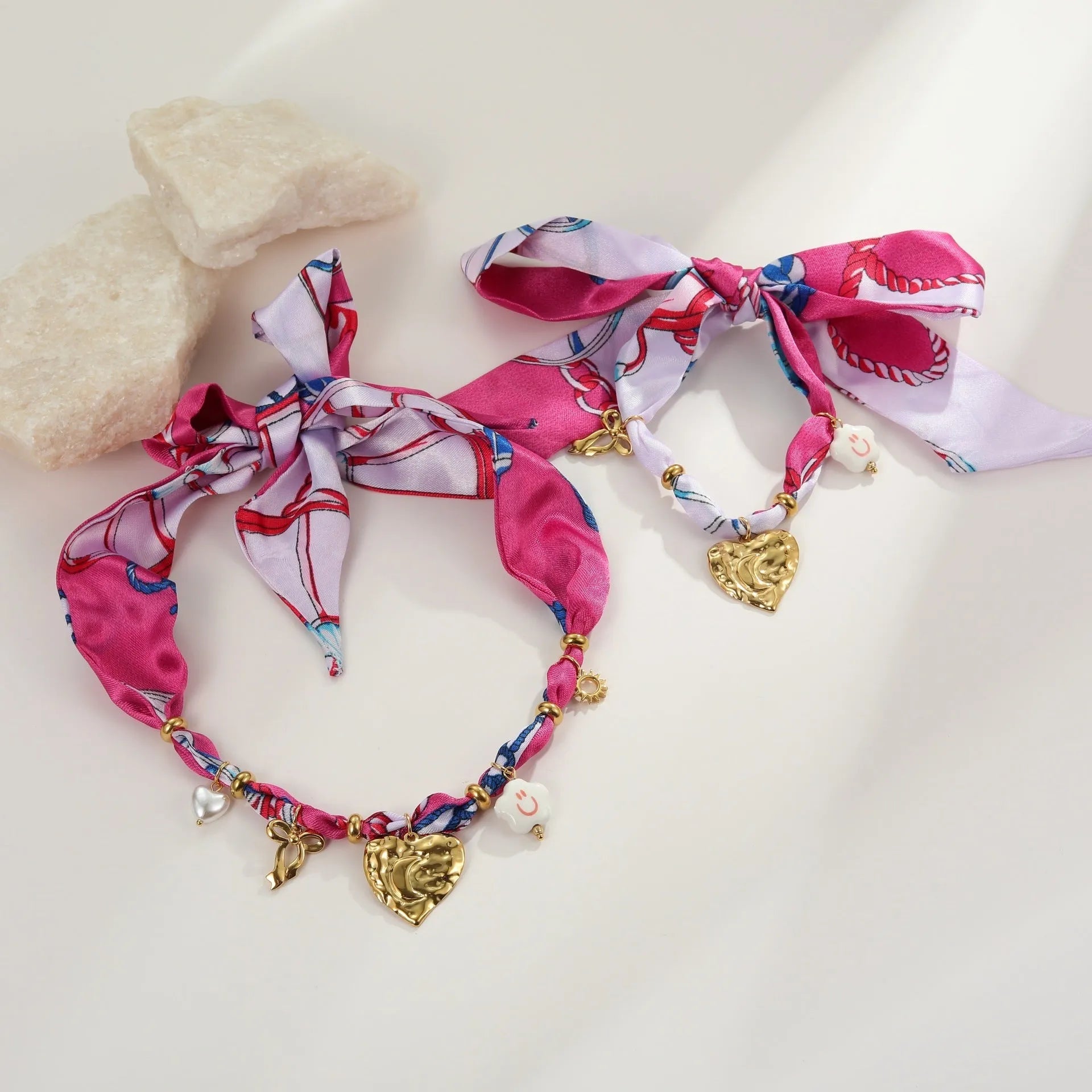 Gold-plated stainless steel necklace and bracelet set with geometric love pendant on adjustable chain