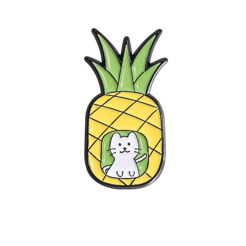Colourful cartoon fruit design zinc alloy brooch pin on a fabric background.