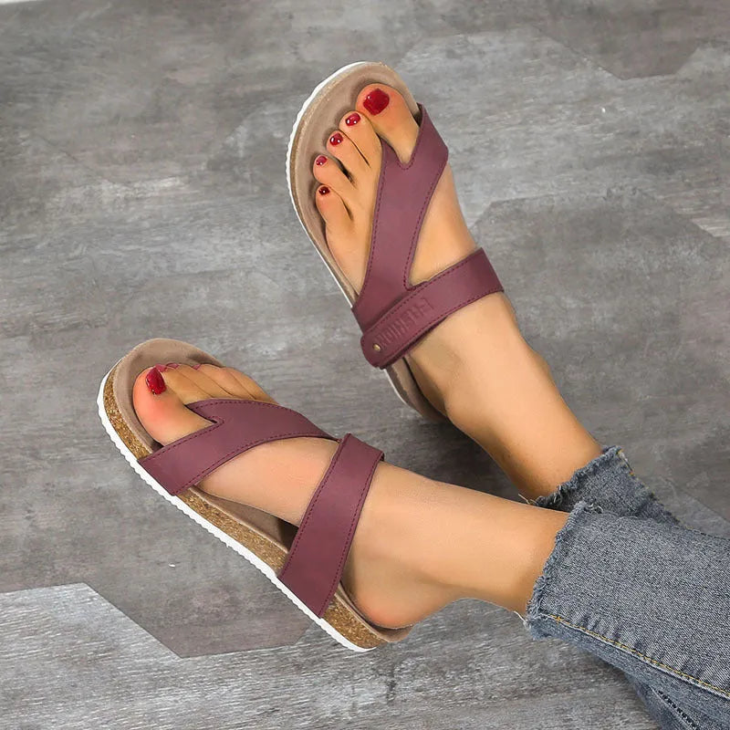 Blue flat toe ring flip-flops with a thick foam sole on a solid background.
