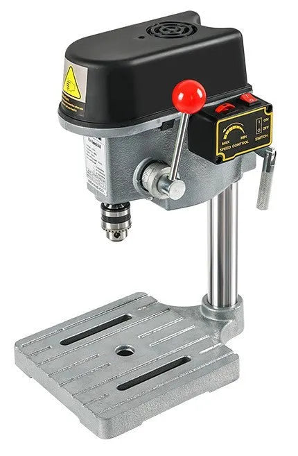 Mini bench drill and milling machine with heavy-duty bench pliers on a workbench.