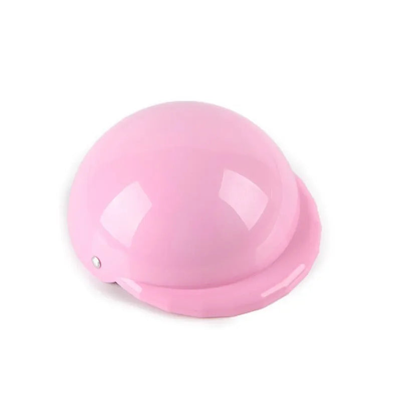 Plastic dog motorcycle cap helmet in various colours and sizes on a table