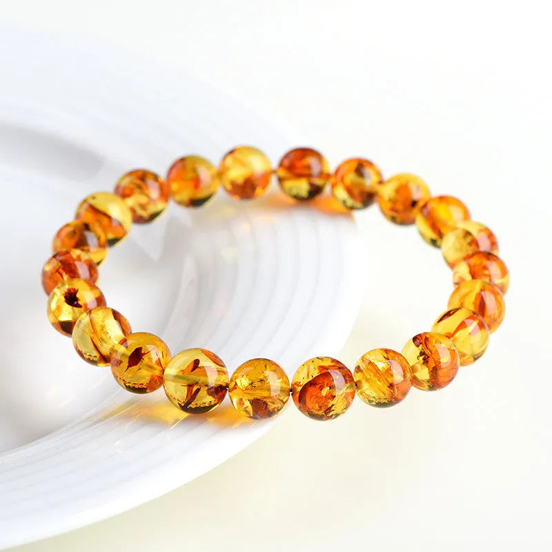 Natural yellow piebald amber bracelet with geometric beads for water purification