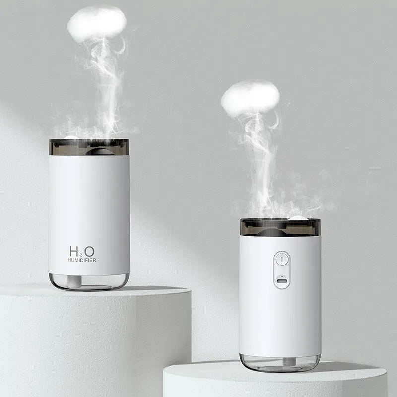 Jellyfish-shaped humidifier producing smoke ring mist with warm night light illumination
