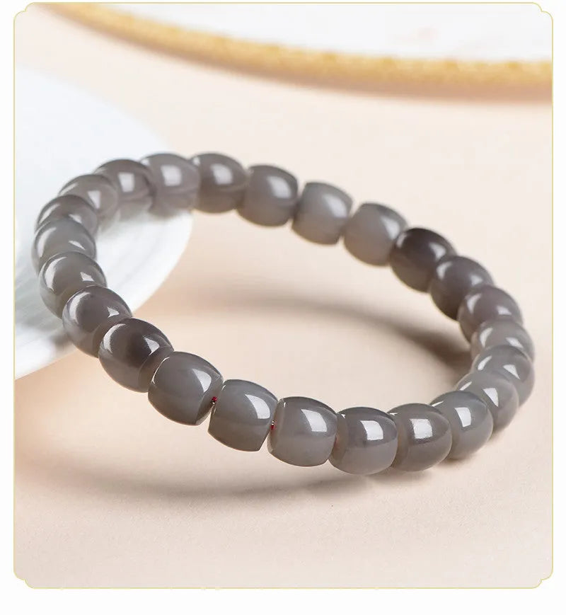 Smokey violet Hetian jade straight cut bracelet with approximately 24 polished 8x9mm beads