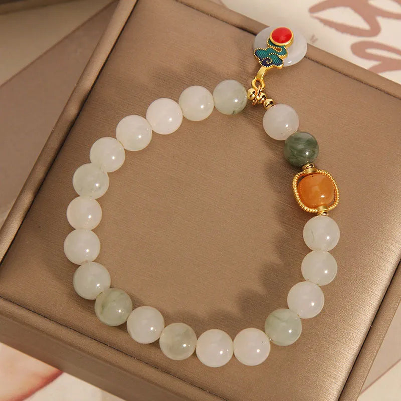 Ice jade women's bracelet with xiangyun peace jade buckle and pearl detailing