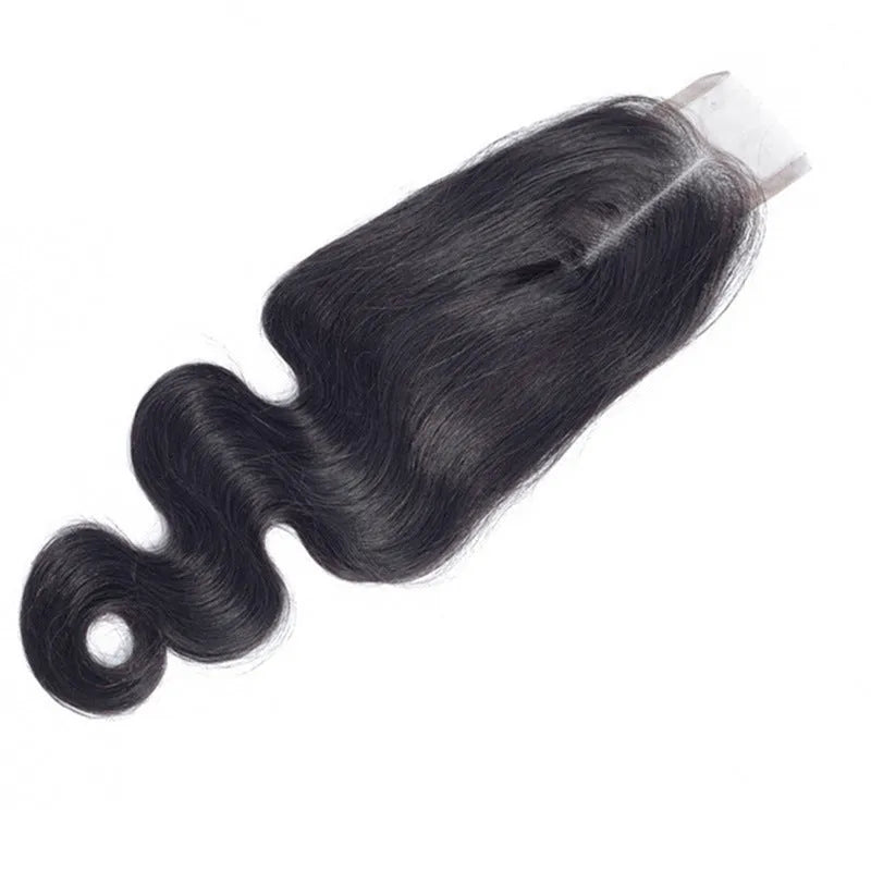A woman wearing a straight, natural-coloured human hair wig, showcasing its length and realistic texture.