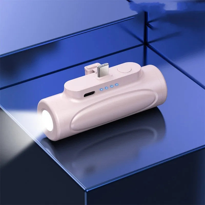 Black and pink portable power bank with integrated LED flashlight, showing Type-C and Apple port options.