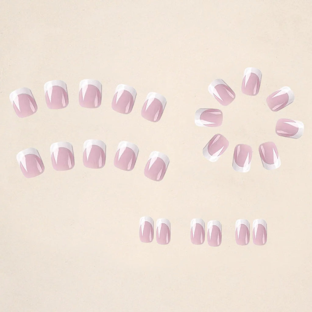 24 white plastic false nail tips with a black and white plaid pattern.
