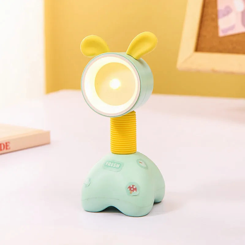 DIY magnetic cartoon small night lamp with multi-angle adjustable lighting on desktop