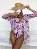 Women's floral print bikini three-piece set with halter-neck top and matching cover-up