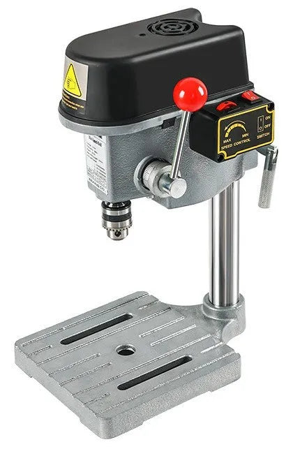 Mini bench drill and milling machine with heavy-duty bench pliers on a workbench.