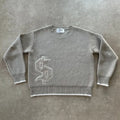 Grey loose-fitting jacquard knit coat on a hanger, showing long sleeves and textured knit pattern.