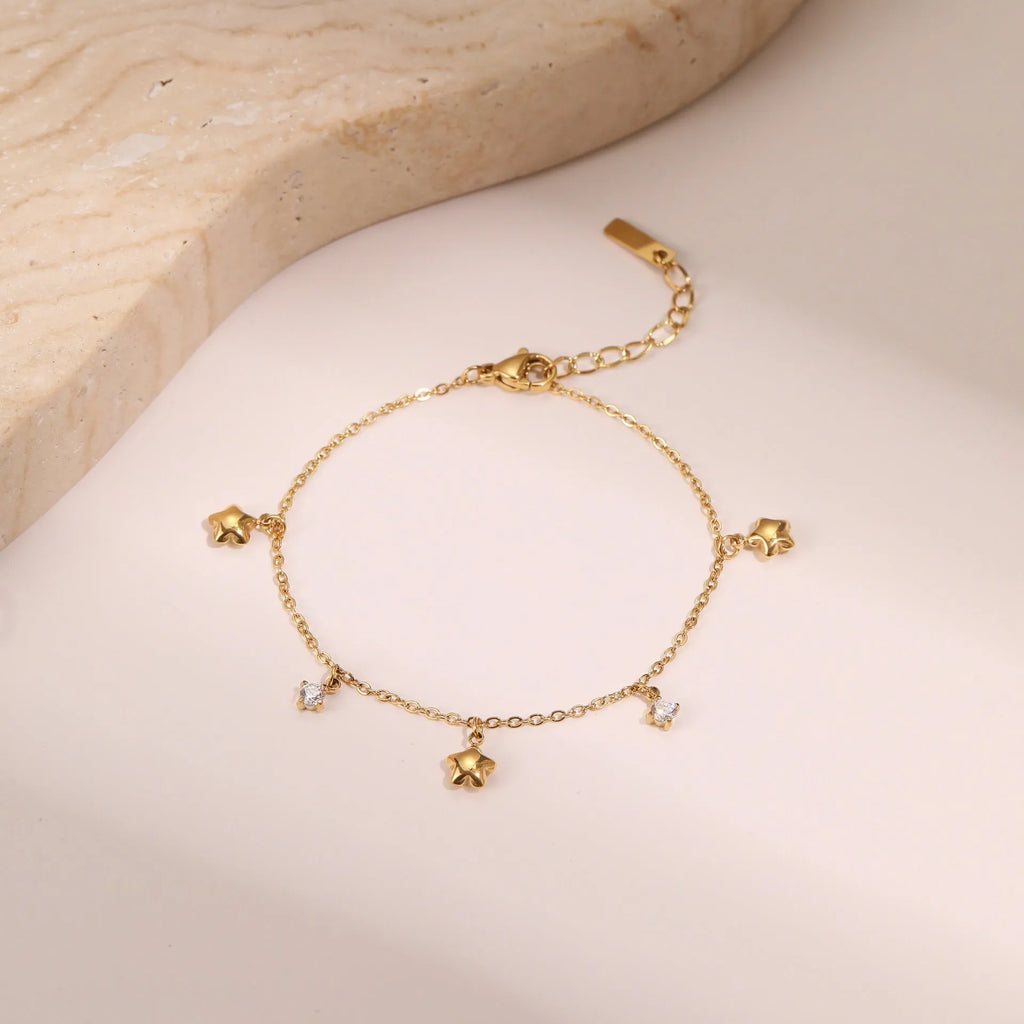 Women's titanium steel bracelet with geometric star pendant and 18K gold plating