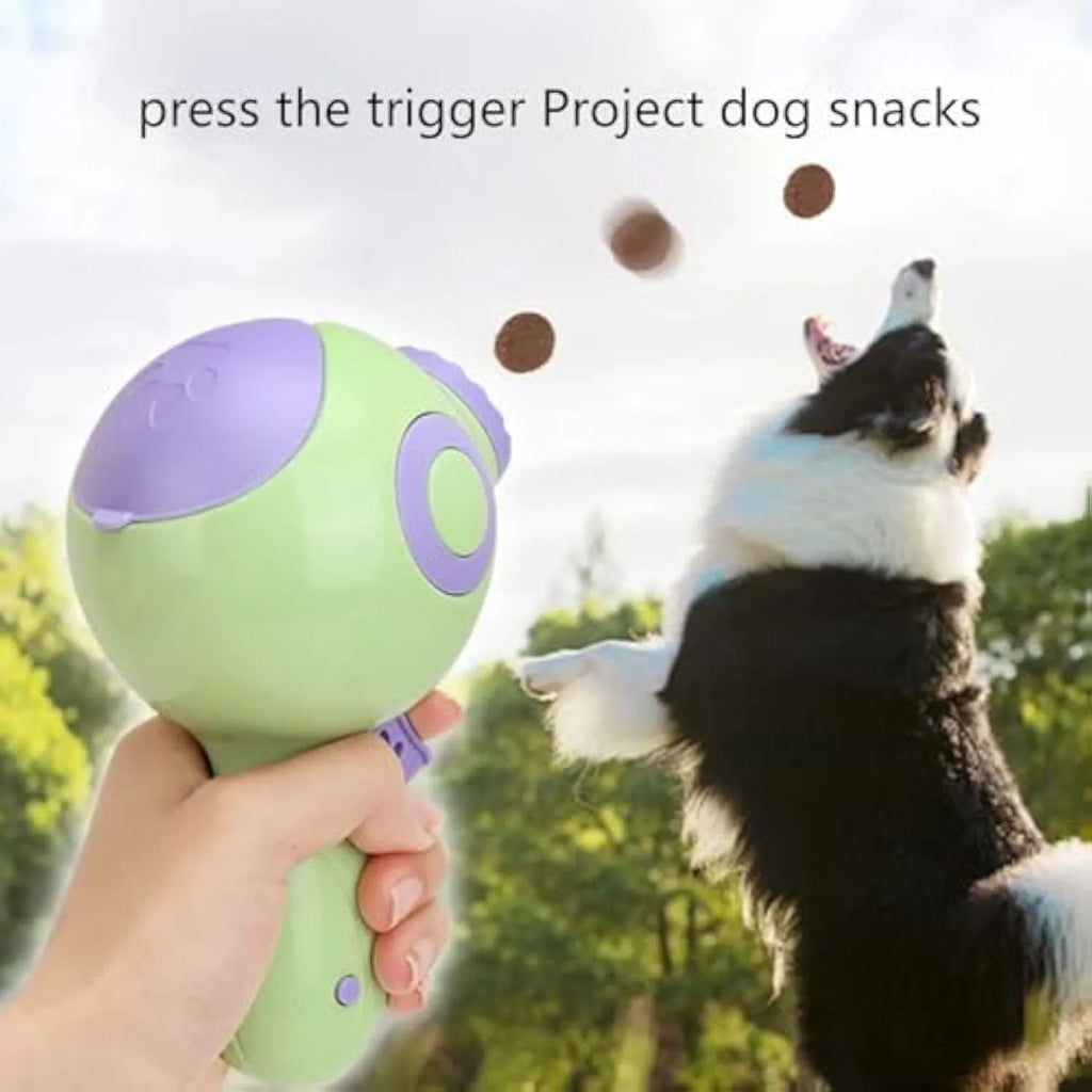 Green, orange, and pink dog treat launcher toy for remote feeding
