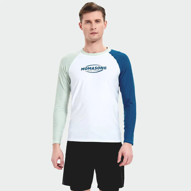 Man wearing a white long-sleeved swim top and matching swim trunks set for beach or pool.