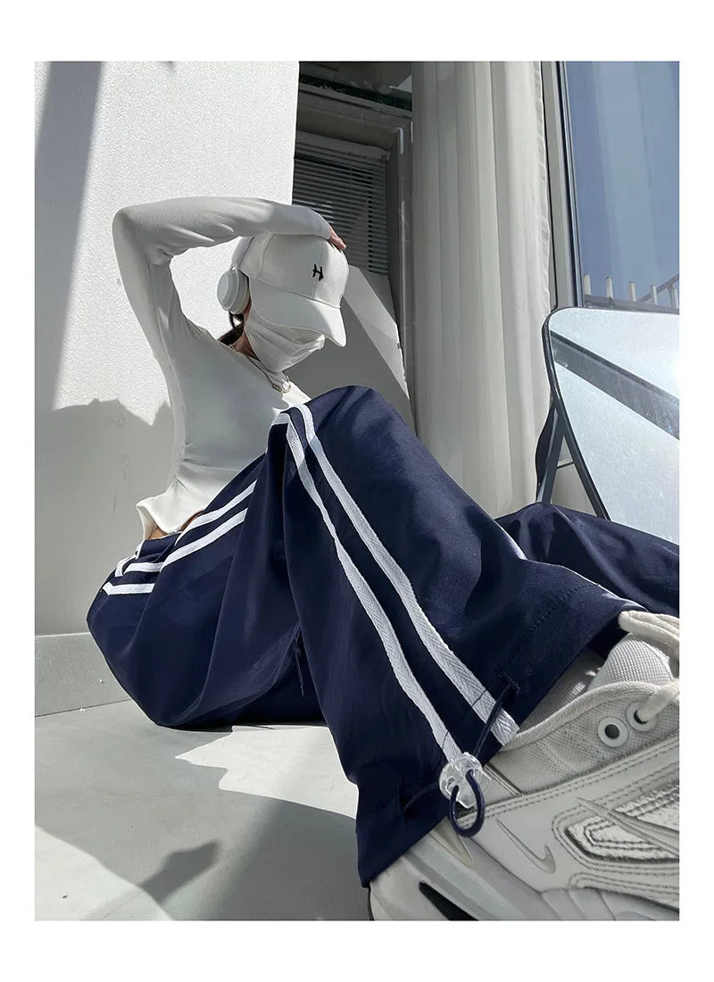 Women's loose straight trousers with contrast ribbon parallel bars detailing in white and navy blue options