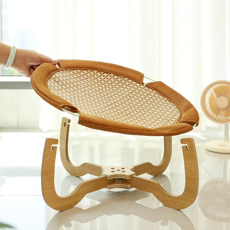 Brown woven rattan pet hammock bed measuring 46cm square with off-ground design