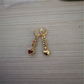 A pair of women's heart-shaped alloy earrings with a gold or silver electroplated finish.
