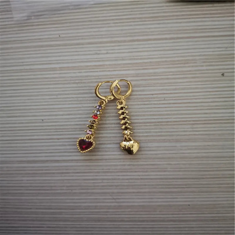 A pair of women's heart-shaped alloy earrings with a gold or silver electroplated finish.